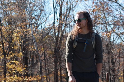 photo of Matt Jones outdoors on a fall hike at Holt's Ledge